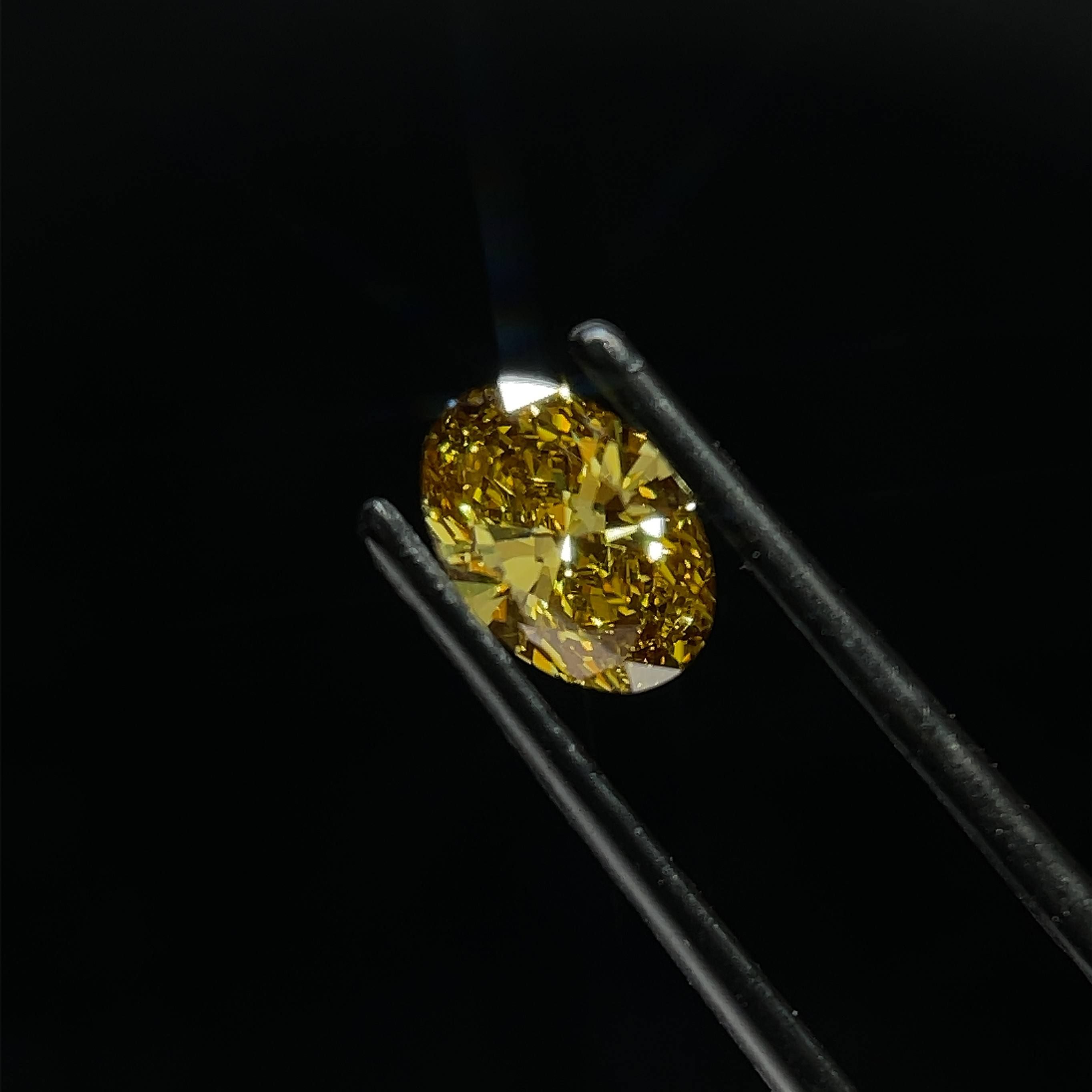 0.99 CT Fancy Intense Brownish Yellow OVAL