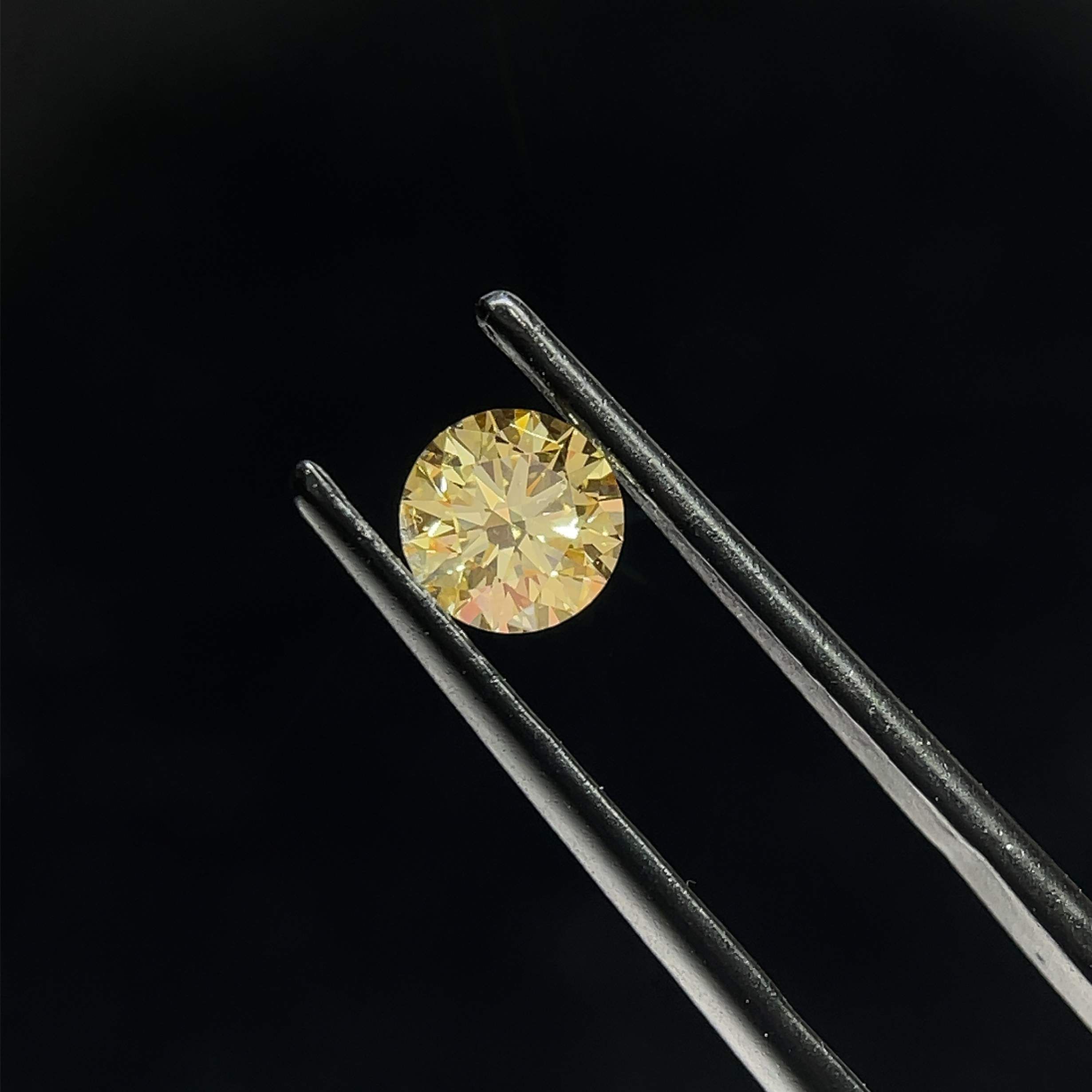 0.73 CT Fancy Yellow ROUND